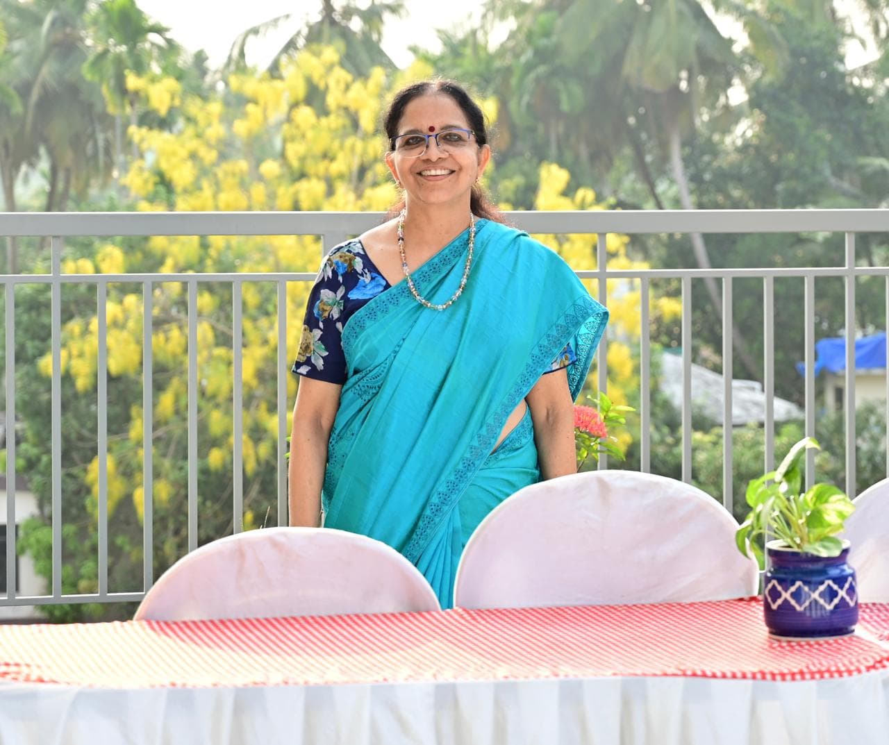 Resident standing beside the event table during Iftar Party 2026