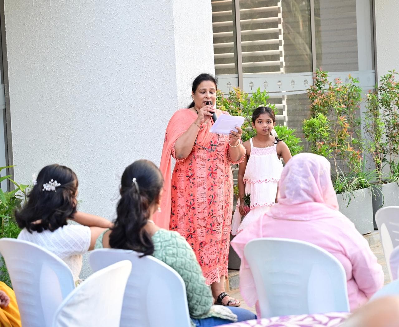 Resident and child presenting during the event