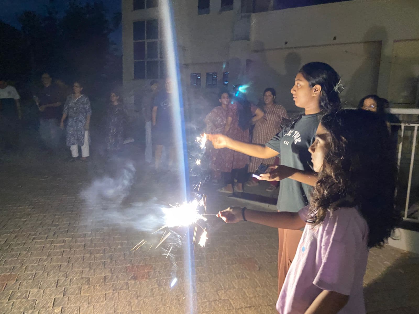 Children holding sparklers during Vishu Celebration 2026