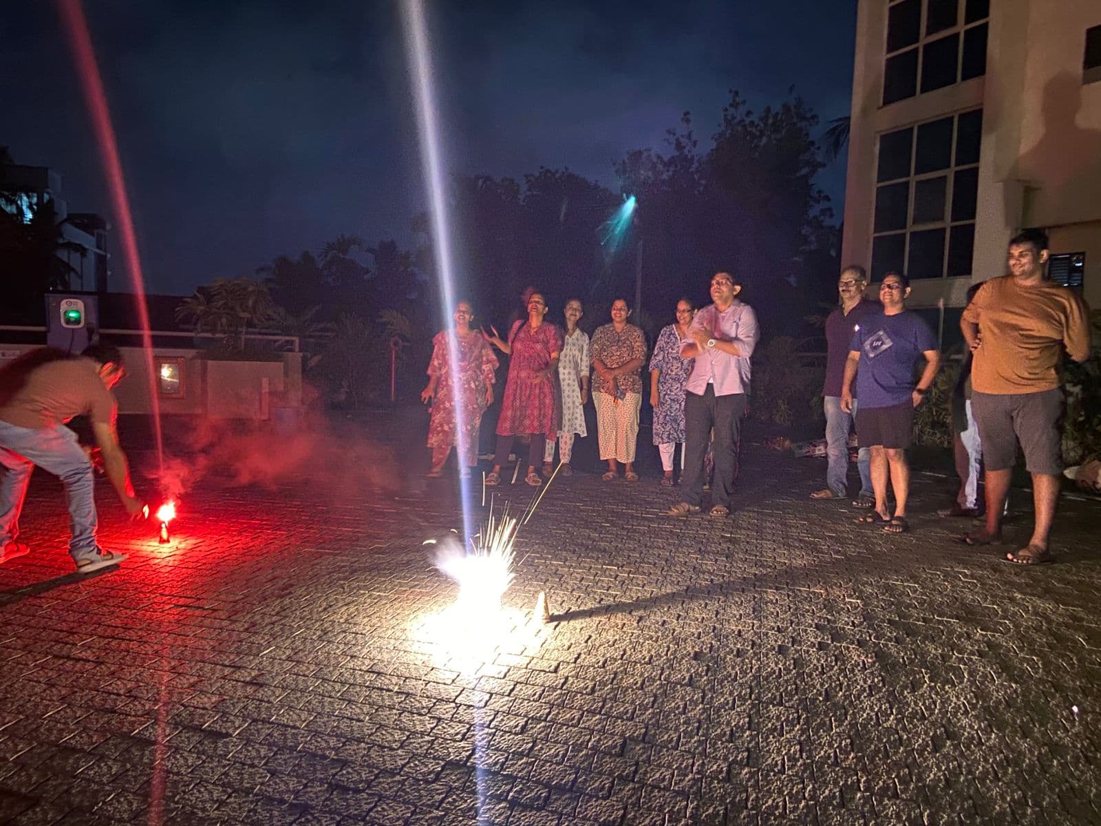 Residents watching fireworks light up the evening courtyard